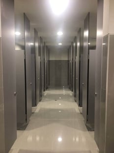 Examples of High-Traffic Spaces Where HPL Cladding Thrives - Workplace bathrooms