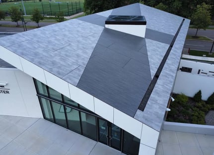 Aerial view of the pjhenolic soffits on the SUNY Binghamton Welcome Center in grey tones