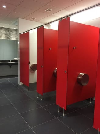 Bathroom stall and urinal partitions; Fundermax Max Compact Interior in Red #0067