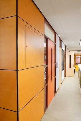 School hallway with woodgrain Fundermax phenolic panels