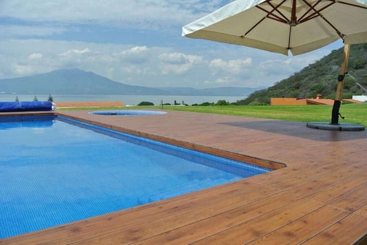 Residential deck made of phenolic panels with mountainous background