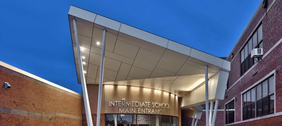 Front of Sodus High School in Sodus, New York, featuring Fundermax phenolic soffits in White