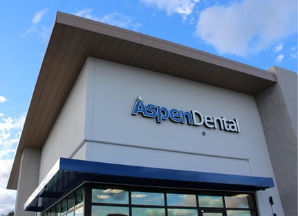 Fundermax phenolic soffits in woodgrain on the Aspen Dental building at the Mainstreet Shopping Center