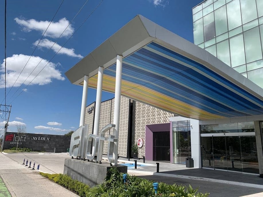 colorful soffits are crafted of Fundermax phenolic panels at Hotel Aloft Querétaro in México.