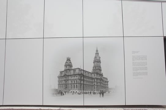 Historical information for a city digitally printed on the side of a building with Fundermax panels