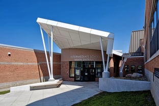 Entryway into Sodus High School with white Fundermax phenolic panels