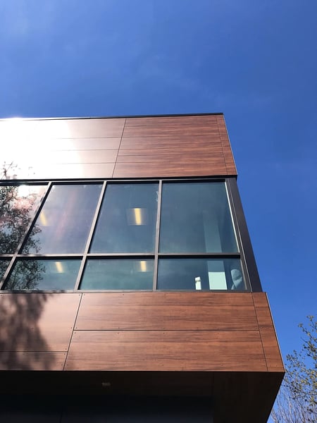 close up of the EDIFIS Group office building project with a woodgrain Fundermax panel