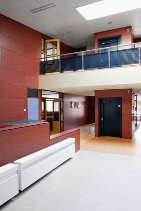 example of Fundermax's Max Compact Interior Plus phenolic panels in a school hallway