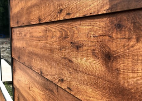 Close up example of a woodgrain exterior phenolic panel