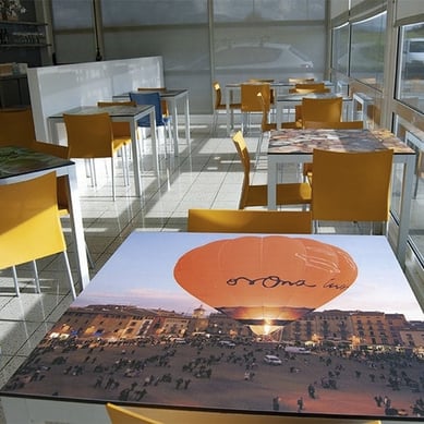Zona Diesel restaurant in Barcelona, Spain; tabletops are digitally printed Fundermax Individualdécor phenolic panels.