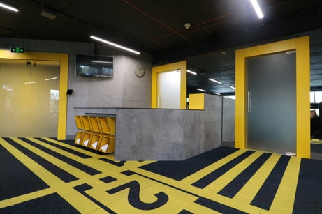 Black and Yellow Emre Group Office Interior - InteriorZine