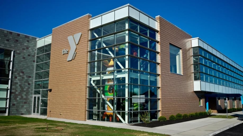 Lockport YMCA using a woodgrain Fundermax phenolic panel in a high-traffic, exterior area.