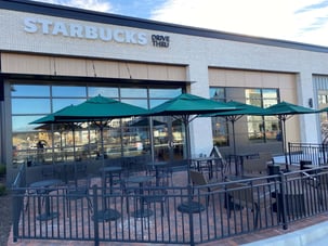 Starbucks in North Carolina with exterior phenolic panels in a shopping center and a exposed fastener.