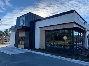 Starbucks in North Carolina with exterior phenolic panels in a woodgrain and a exposed fastener.