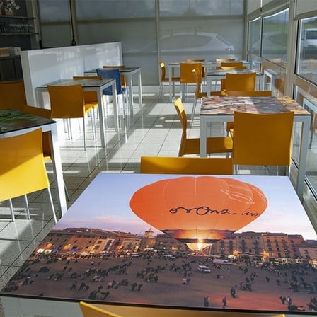 Digitally printed HPL panel with a hot air balloon as a table top in a restaurant