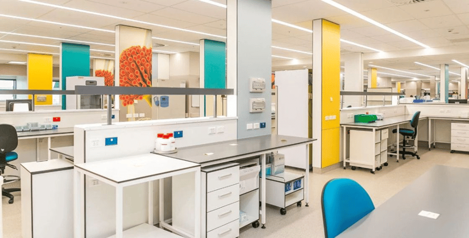 Custom, digitally printed and solid Max Compact Interior phenolic panels in yellow and teal with microscopic inside the Middlemore Hospital in New Zealand