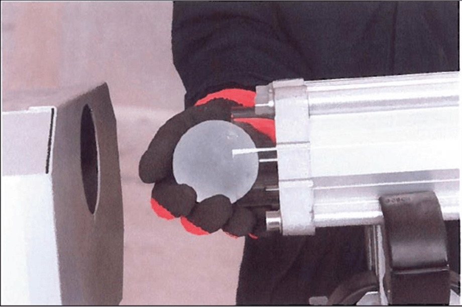Ice balls up to 2 3/4” in diameter are loaded into a firing device to be shot at Fundermax panels at a speed of 67 miles per hour.