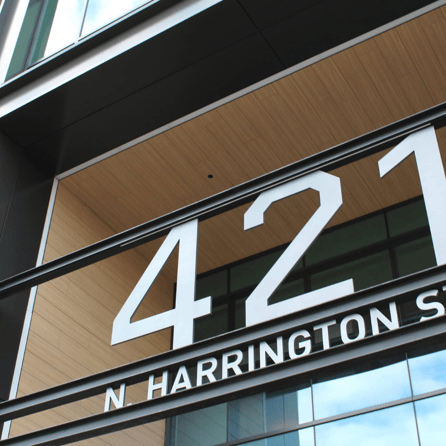 Fundermax woodgrain decor utilized in the soffits at the entrance to 421 N. Harrington St office building