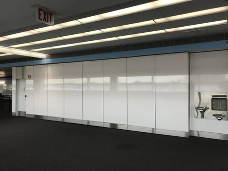Max Compact Interior wall lining in White near a terminal inside the Chicago O'Hare Airport