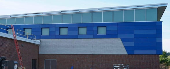 Victor central school exterior phenolic panel installation  and a exposed fastener.